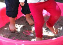 children's feet in mud