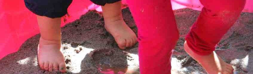 children's feet in mud