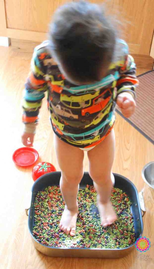 sensory play for feet walking on beans child standing in beans