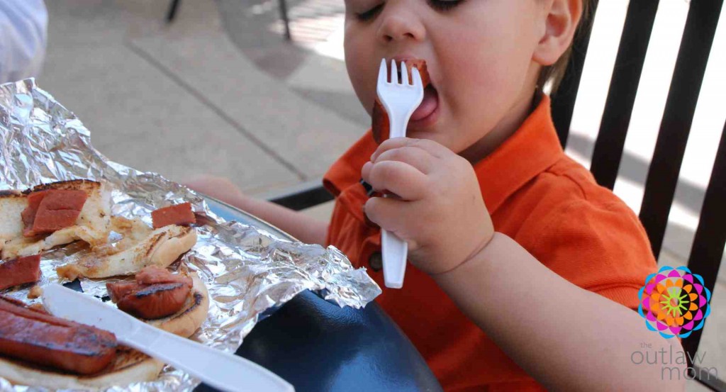 boy eating hot dog