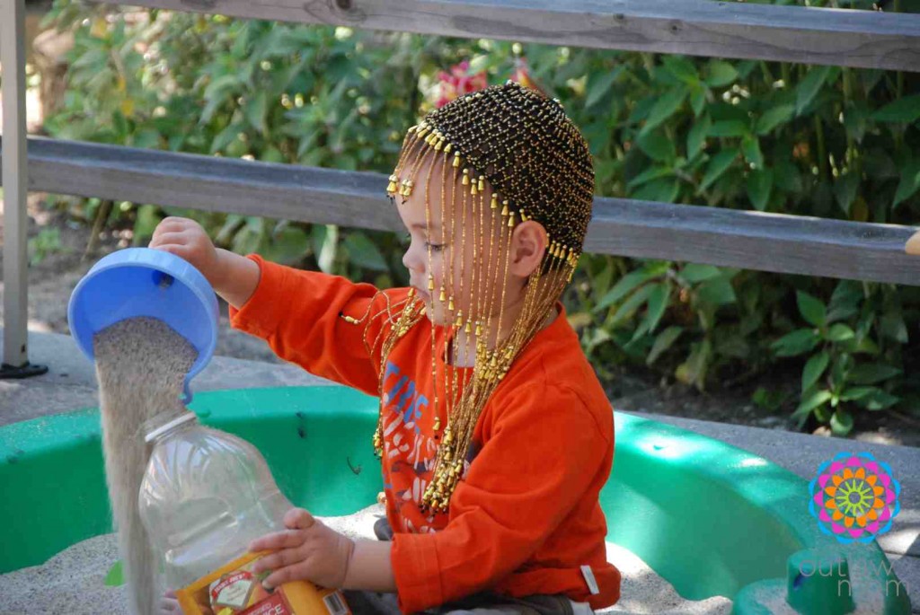 boy playing in sandbox