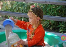 boy playing in sandbox